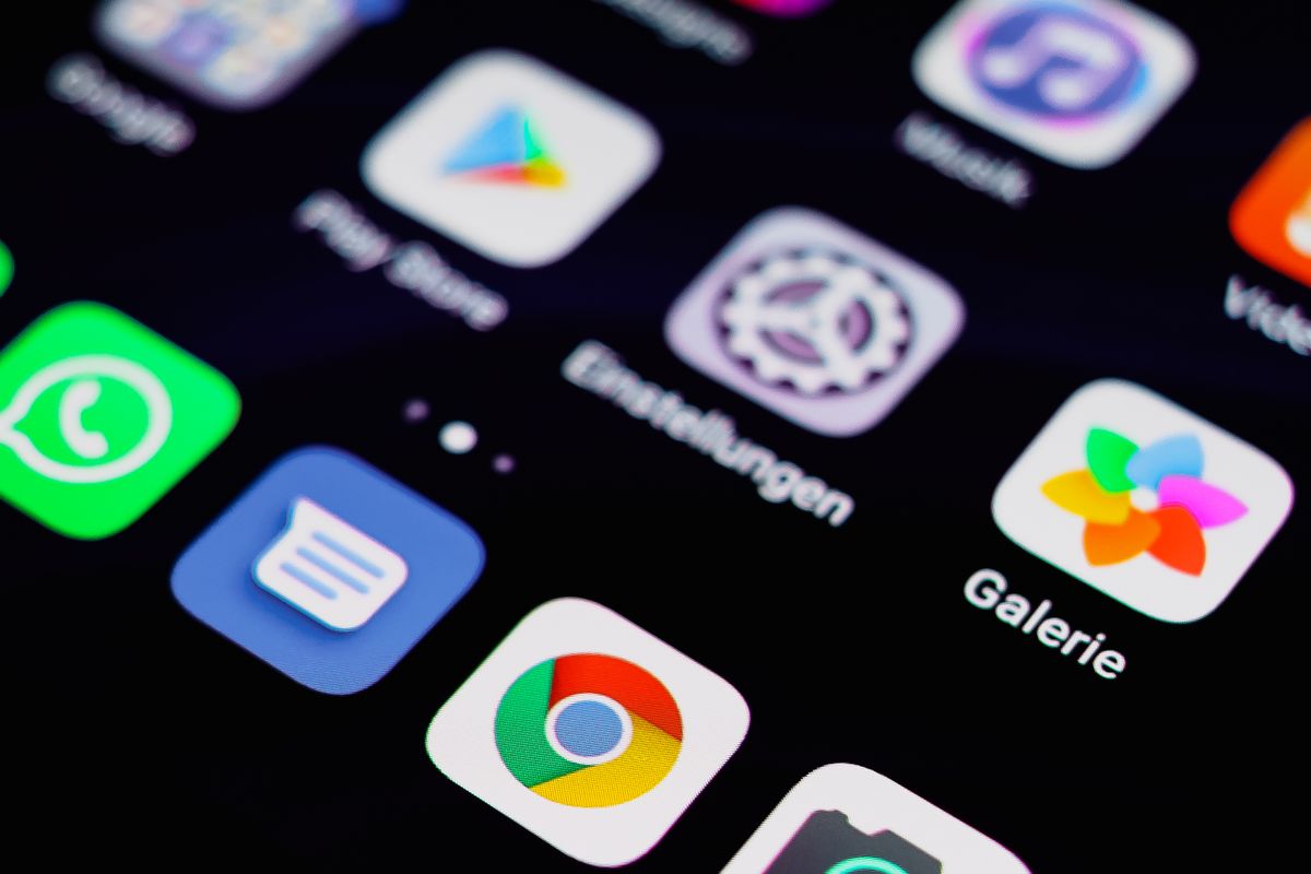 Close-up of app icons including an app store on a phone screen